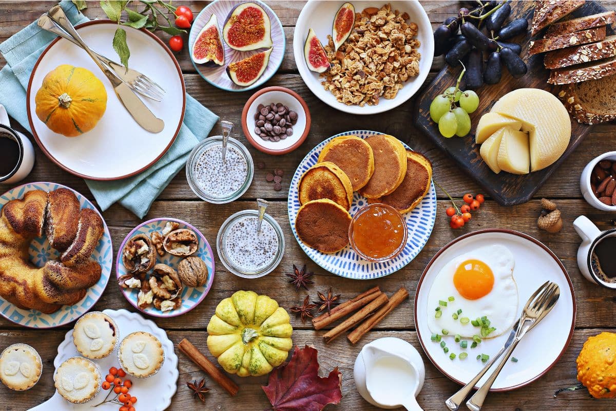 flat lay table brunch pancakes fruit
